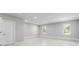 Spacious bonus room featuring tile floors, recessed lighting, and multiple windows at 5041 Ne 4Th St, Ocala, FL 34470