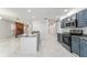 Bright kitchen with granite countertops, stainless steel appliances, and open access to the living area at 5041 Ne 4Th St, Ocala, FL 34470
