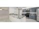 Stunning kitchen featuring granite countertops, stainless steel appliances, and tiled floors in an open layout at 5041 Ne 4Th St, Ocala, FL 34470