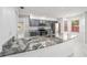 Gorgeous kitchen with granite countertops, stainless steel appliances, and custom cabinets throughout at 5041 Ne 4Th St, Ocala, FL 34470