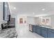 Updated kitchen featuring granite countertops, stainless steel appliances, and an adjacent breakfast nook with natural light at 5041 Ne 4Th St, Ocala, FL 34470