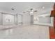 Spacious living room with marble tile flooring, fireplace, and modern lighting at 5041 Ne 4Th St, Ocala, FL 34470