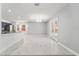 The living room features marble tile floors, neutral paint, updated fixtures, and patio access at 5041 Ne 4Th St, Ocala, FL 34470