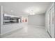 The living room features marble tile floors, neutral paint, updated fixtures, and patio access at 5041 Ne 4Th St, Ocala, FL 34470