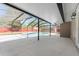 Spacious screened-in patio overlooking a swimming pool and a tidy backyard at 5041 Ne 4Th St, Ocala, FL 34470