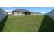Generous backyard with a white privacy fence offering ample space for outdoor activities and entertaining at 5086 Sw 91St St, Ocala, FL 34476
