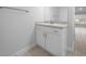 Bathroom featuring white vanity with light granite countertop and faucet at 5086 Sw 91St St, Ocala, FL 34476