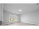 Bedroom featuring a large window and neutral color palette at 5086 Sw 91St St, Ocala, FL 34476