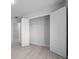 Walk-in closet with open doors and rod, complemented by light wood-look floors at 5086 Sw 91St St, Ocala, FL 34476