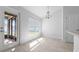 Light-filled dining area featuring modern chandelier and view of the backyard at 5086 Sw 91St St, Ocala, FL 34476