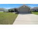 Charming single-story home featuring a spacious two-car garage and well-maintained front lawn at 5086 Sw 91St St, Ocala, FL 34476