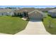 Charming single-story home featuring a well-manicured front yard, and attached two-car garage at 5086 Sw 91St St, Ocala, FL 34476