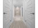 Hallway view showcasing doors and walk-in shower at 5086 Sw 91St St, Ocala, FL 34476