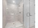 Modern bathroom featuring a glass-enclosed shower with tile surround and sleek fixtures at 5086 Sw 91St St, Ocala, FL 34476