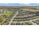 Panoramic aerial view of the community with a golf course and scenic surroundings at 5563 Nw 40Th Pl, Ocala, FL 34482