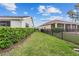Spacious backyard featuring a green lawn and privacy fence between neighboring properties at 5563 Nw 40Th Pl, Ocala, FL 34482