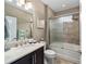 Bathroom with modern fixtures, vanity with sink, and shower with glass door at 5563 Nw 40Th Pl, Ocala, FL 34482