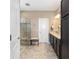 Bathroom featuring tiled shower, double sinks, and ample counter space at 5563 Nw 40Th Pl, Ocala, FL 34482