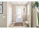 Welcoming entryway features tiled floors, a glass-paneled door, and ample natural light at 5563 Nw 40Th Pl, Ocala, FL 34482