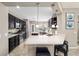 Well-appointed kitchen with stainless steel appliances, quartz counters, breakfast bar, and ample cabinet space at 5563 Nw 40Th Pl, Ocala, FL 34482