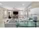 Spacious living room with tile flooring, modern decor, and large windows for ample natural light at 5563 Nw 40Th Pl, Ocala, FL 34482