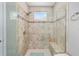 Tiled walk-in shower with built in bench and handheld shower head at 5563 Nw 40Th Pl, Ocala, FL 34482