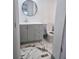 Stylish bathroom with a sink, vanity, toilet, and marble-look tile floor at 5860 Sw 64Th Street Rd, Ocala, FL 34474