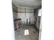 Shed featuring a work table, shelving, and electrical connections at 5860 Sw 64Th Street Rd, Ocala, FL 34474