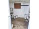 Shed featuring a concrete blocks, pegboard, shelving, and concrete flooring at 5860 Sw 64Th Street Rd, Ocala, FL 34474
