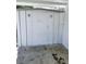 An outdoor storage shed featuring secure door, lighting, and concrete slab at 5860 Sw 64Th Street Rd, Ocala, FL 34474
