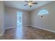 Spacious bedroom with an arched window, tile flooring, and access to the pool at 5916 Nw 27Th Pl, Ocala, FL 34482