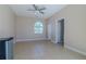The bedroom features an arched window, tiled floors, a ceiling fan, and a double-door closet at 5916 Nw 27Th Pl, Ocala, FL 34482