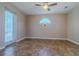 Bright bedroom with tile flooring, ceiling fan, and access to the outdoor area at 5916 Nw 27Th Pl, Ocala, FL 34482