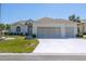 Charming single-story home with a three-car garage and well-manicured lawn at 5916 Nw 27Th Pl, Ocala, FL 34482