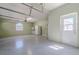 The garage has a light-green wall paint, and features a side-entry door and a window at 5916 Nw 27Th Pl, Ocala, FL 34482