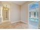 Hallway leading to the pool area with tile floors and natural light at 5916 Nw 27Th Pl, Ocala, FL 34482
