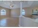 Bright living room with tile flooring, ceiling fan, and lots of natural light at 5916 Nw 27Th Pl, Ocala, FL 34482