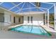 A screened-in pool features outdoor furniture, a blue sky, and access to the house at 5916 Nw 27Th Pl, Ocala, FL 34482