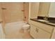 Stylish bathroom boasts tiled shower/tub, granite counters, and neutral color palette at 6047 Sw 128Th Street Rd, Ocala, FL 34473