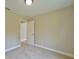 Carpeted bedroom featuring a doorway at 6047 Sw 128Th Street Rd, Ocala, FL 34473