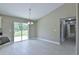 Bright dining area with sliding glass doors and neutral tile flooring at 6047 Sw 128Th Street Rd, Ocala, FL 34473