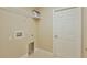 Bright laundry room features tiled floor and white wire shelving for storage at 6047 Sw 128Th Street Rd, Ocala, FL 34473