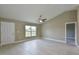 Bright living room with tile floors, vaulted ceilings, and lots of natural light at 6047 Sw 128Th Street Rd, Ocala, FL 34473