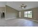 Open living room featuring vaulted ceilings, tile floors, and neutral paint at 6047 Sw 128Th Street Rd, Ocala, FL 34473