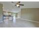 Open concept living area with tile floors, stainless appliances and a kitchen island at 6047 Sw 128Th Street Rd, Ocala, FL 34473
