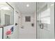 A bathroom featuring a glass enclosed bathtub and shower, with tile accents at 6125 Se 11Th St, Ocala, FL 34472