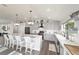 Well-appointed kitchen boasts gray cabinetry, stainless steel appliances, and a spacious quartz countertop island at 6125 Se 11Th St, Ocala, FL 34472