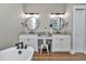 Bright bathroom featuring double vanities, modern fixtures, and granite counters at 7432 Ne 26Th Ave, Ocala, FL 34479