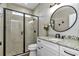 Bathroom featuring a glass shower with black trim, granite vanity, toilet, and ceramic tile at 7432 Ne 26Th Ave, Ocala, FL 34479