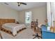 Bedroom featuring neutral walls, bright windows, and a desk at 7432 Ne 26Th Ave, Ocala, FL 34479